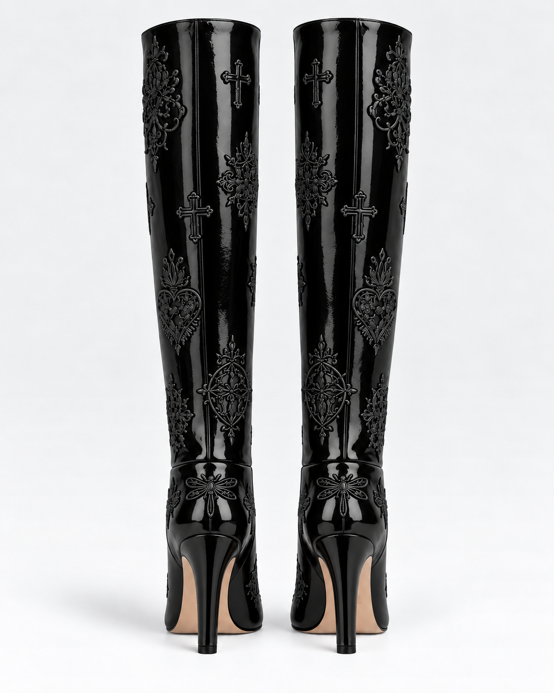 Back view of the shiny black patent leather embroidered tall boots, showing shaft seams, tonal embroidery and substantial heels.