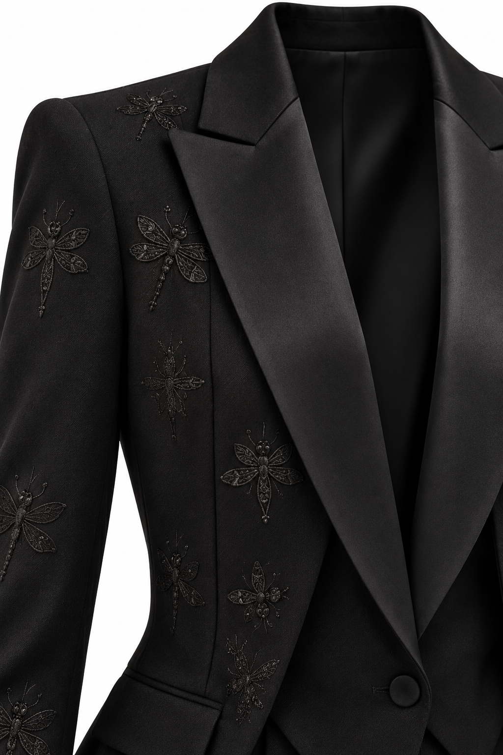Close-up of the black tuxedo suit shoulder, satin lapel and embroidered dragonfly detail.