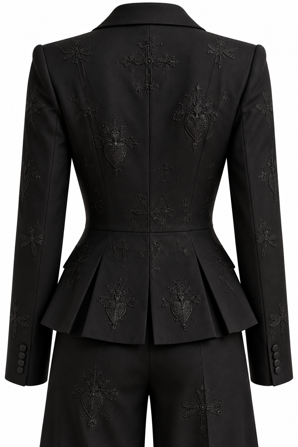 Close-up of the black tuxedo suit’s embroidered back peplum construction.