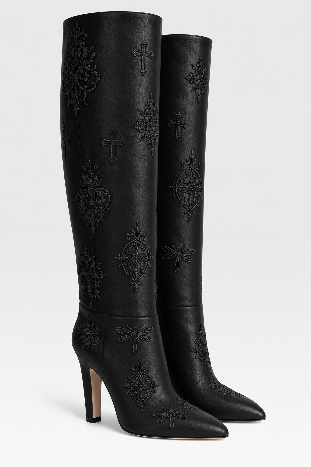 LIGNES D’OMBRE Embroidered Block-Heel Tall Boots in Black. Tall shafts and pointed toes are set on substantial heels, with tonal embroidered motifs.