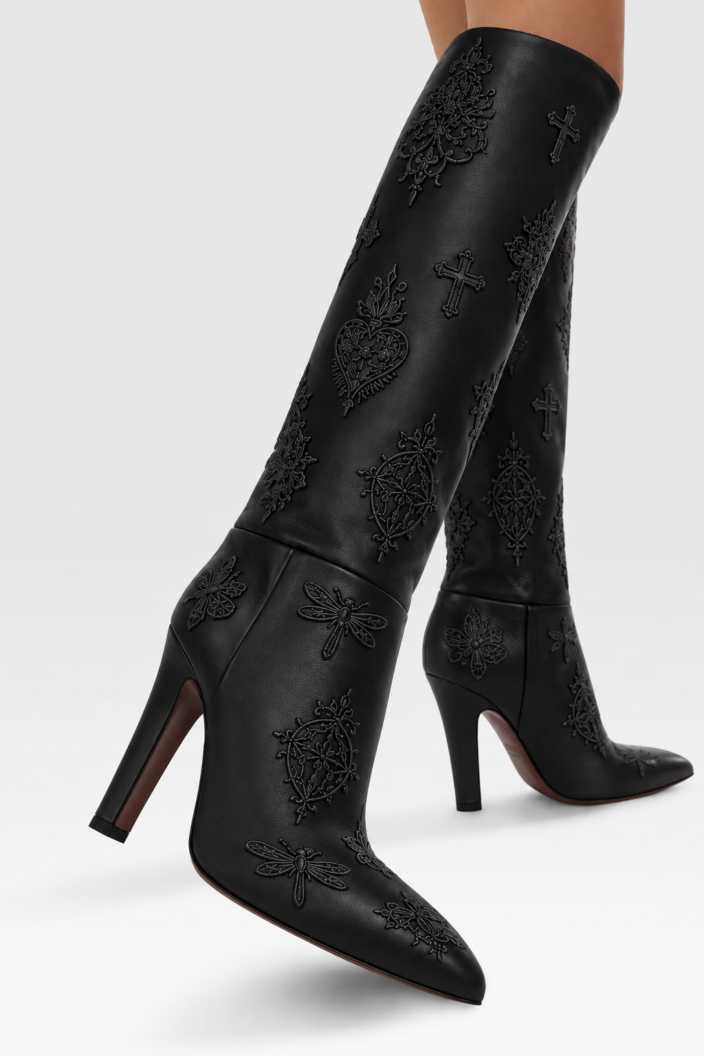 LIGNES D’OMBRE Embroidered Block-Heel Tall Boots in Black. Tall shafts and pointed toes are set on substantial heels, with tonal embroidered motifs.
