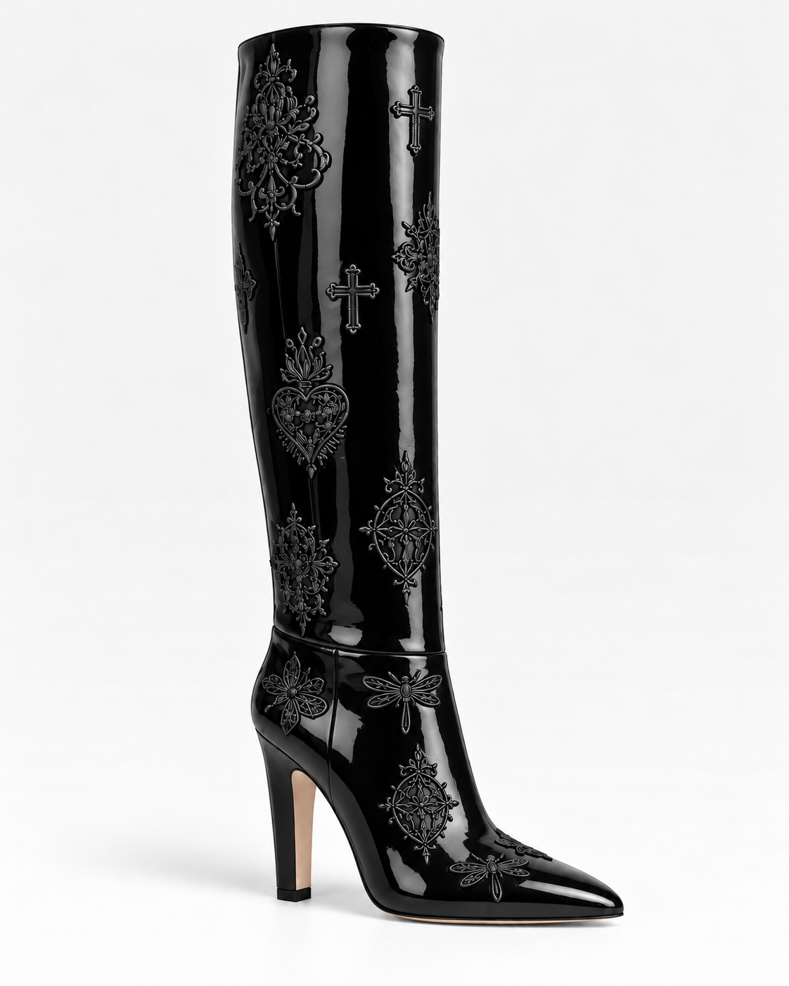 Side view of a shiny black patent leather embroidered tall boot, showing its substantial heel and pointed toe.