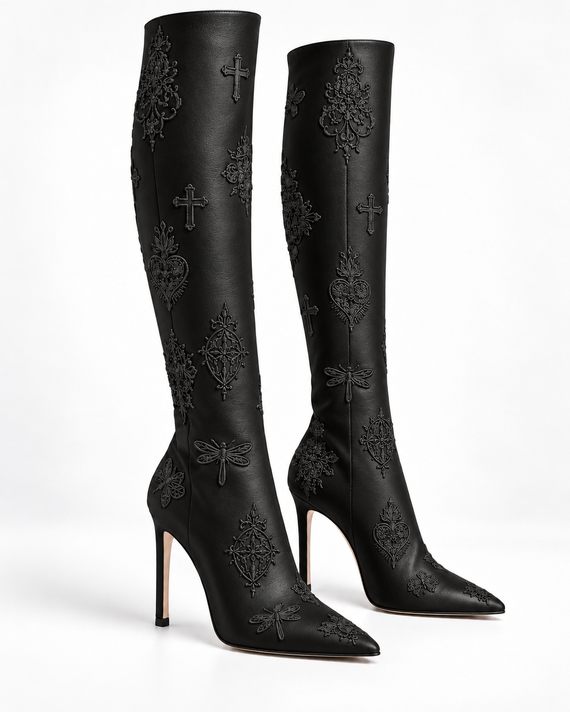 Three-quarter view of the black leather embroidered stiletto tall boots, showing tonal motifs and slender heels.
