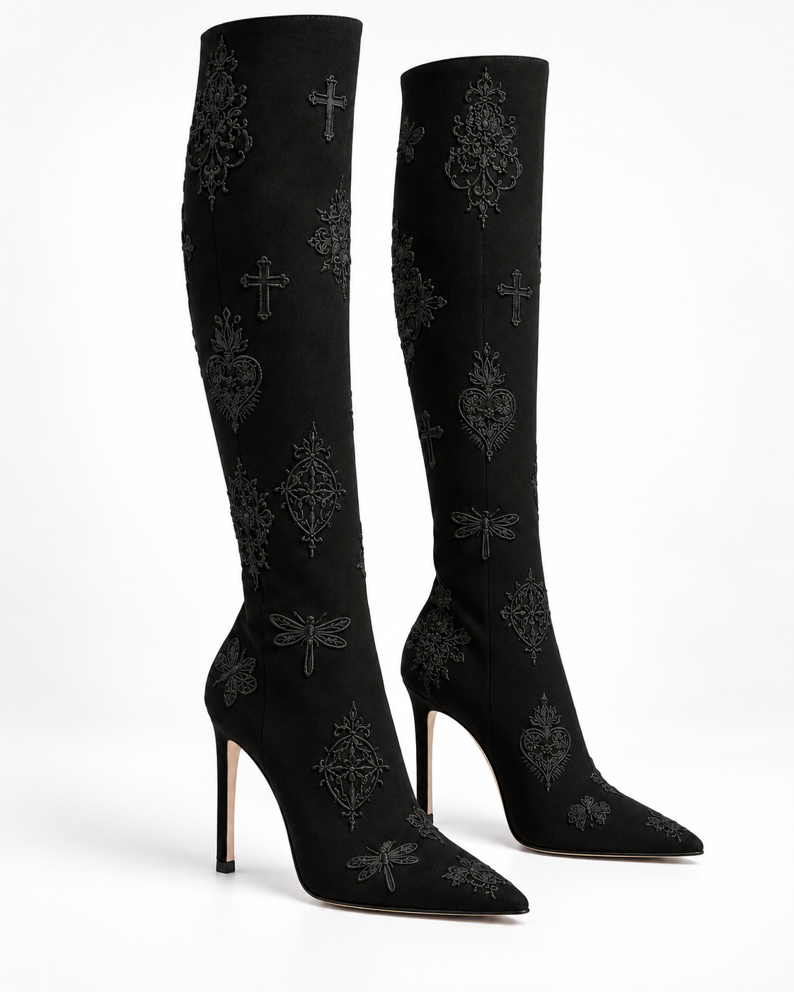 Three-quarter view of the black embroidered stiletto tall boots, showing the fitted shafts and pointed toes.