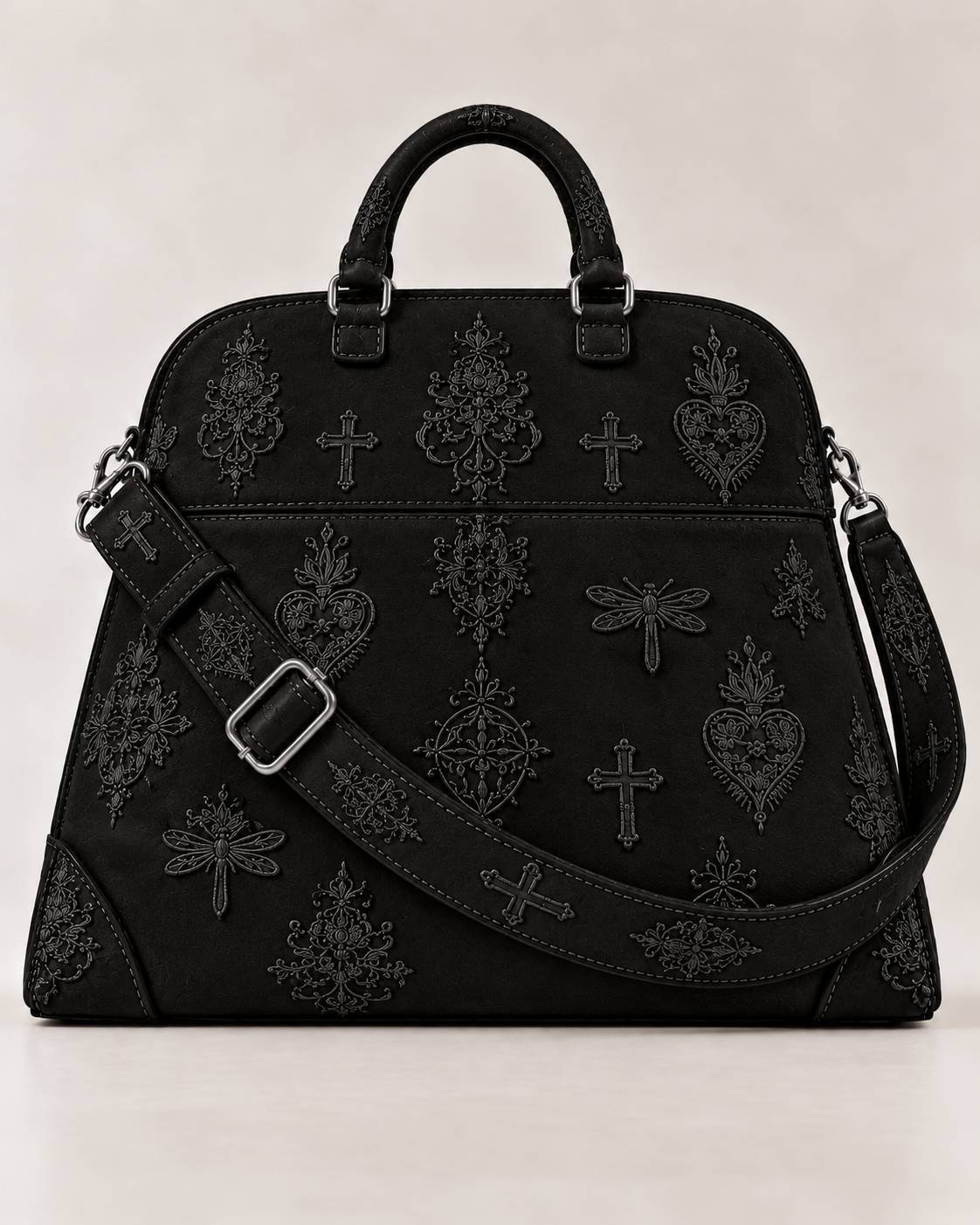 Front view of the black LIGNES D’OMBRE embroidered structured handbag, with rounded handles, an adjustable shoulder strap and silver-tone hardware.