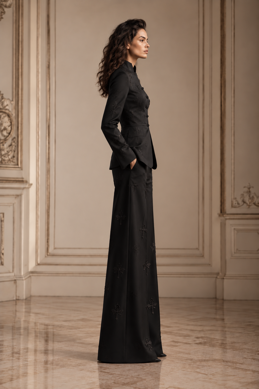 Side view of the black silk satin stand-collar trouser suit, showing the shaped jacket waist and wide-leg silhouette.