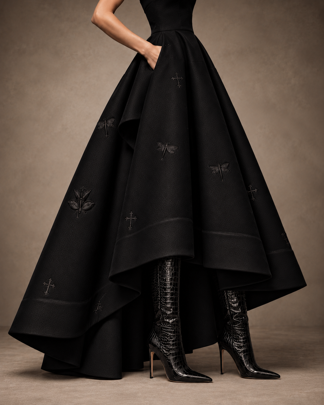 Close-up of the gown’s voluminous folds, side pocket, tonal embroidery and high-low hem.