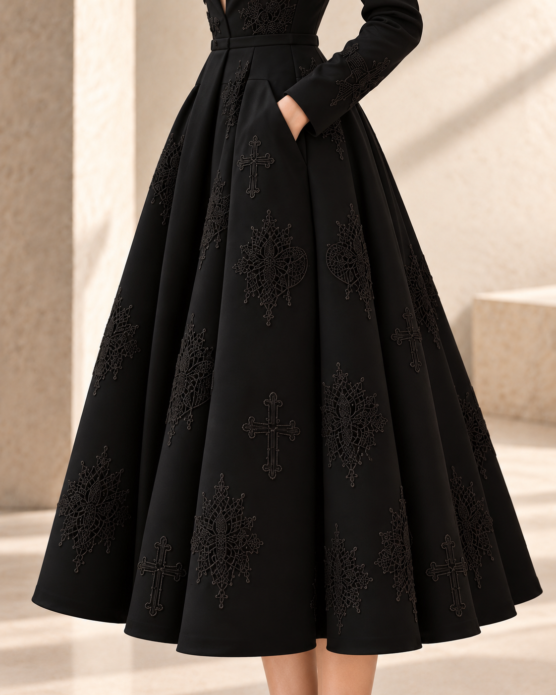 LIGNES D’OMBRE V-Neck Embroidered Full-Skirt Dress in Black, close view of the full skirt, pleats, side pocket and tonal embroidered motifs.
