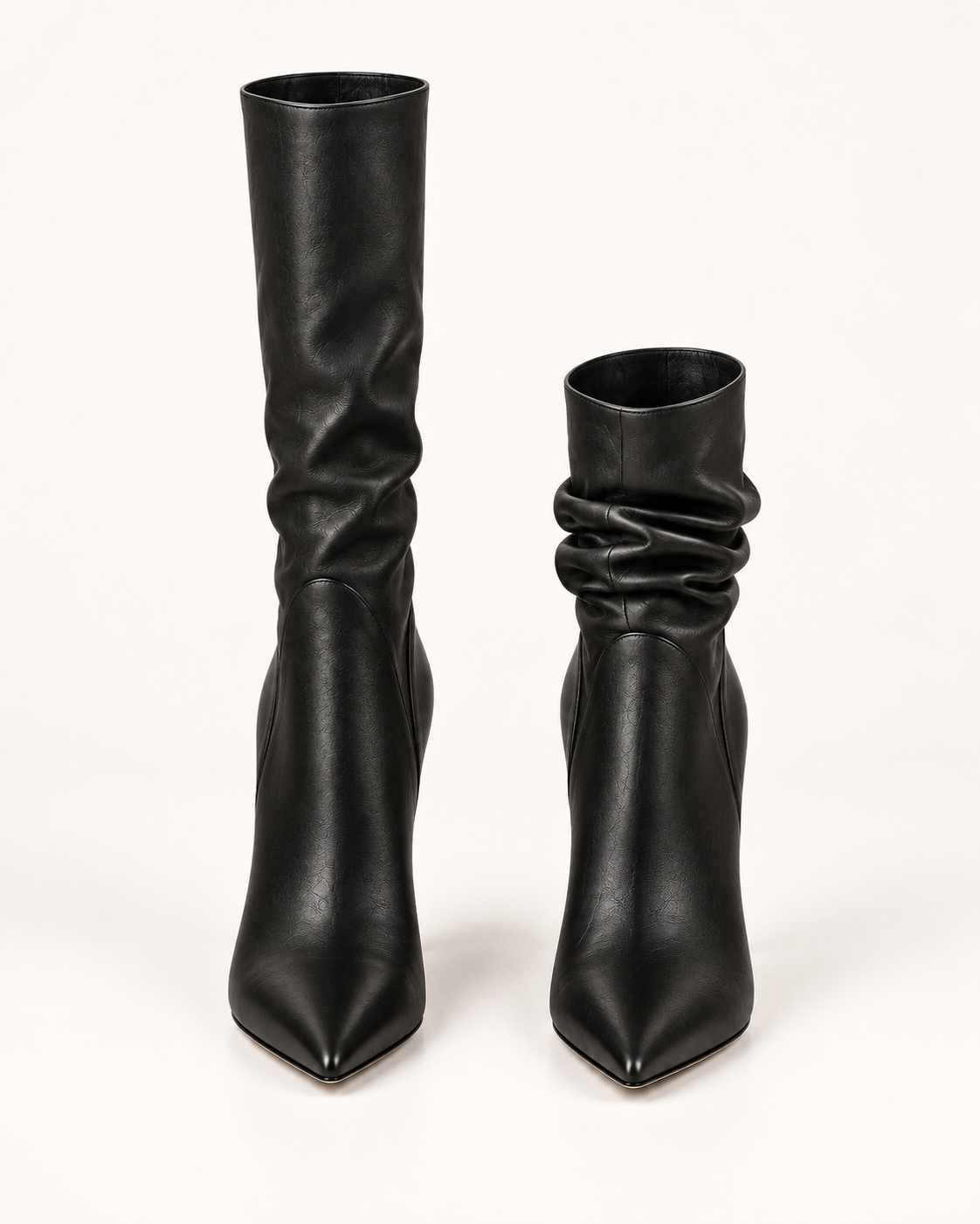 PLIS D’OMBRE black Adjustable-Shaft Boots, front view showing pointed toes and shafts set at different heights, one extended and one gathered.