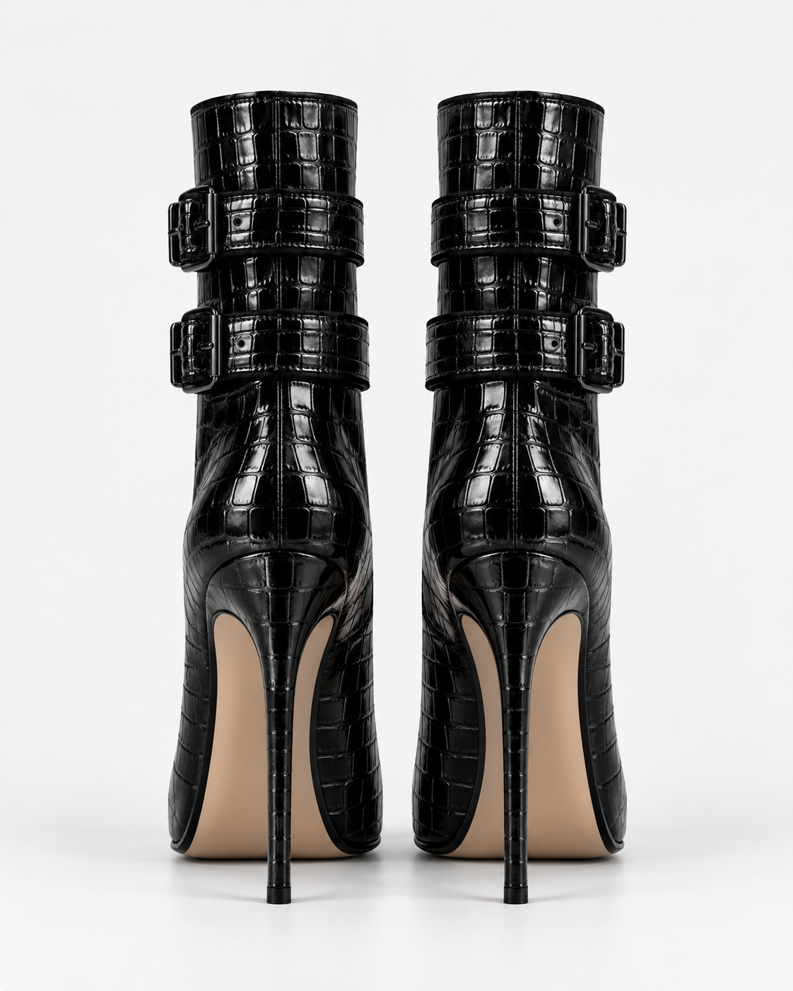 Back view of the black croc-effect double-buckle ankle boots, showing shaft construction and slender heels.