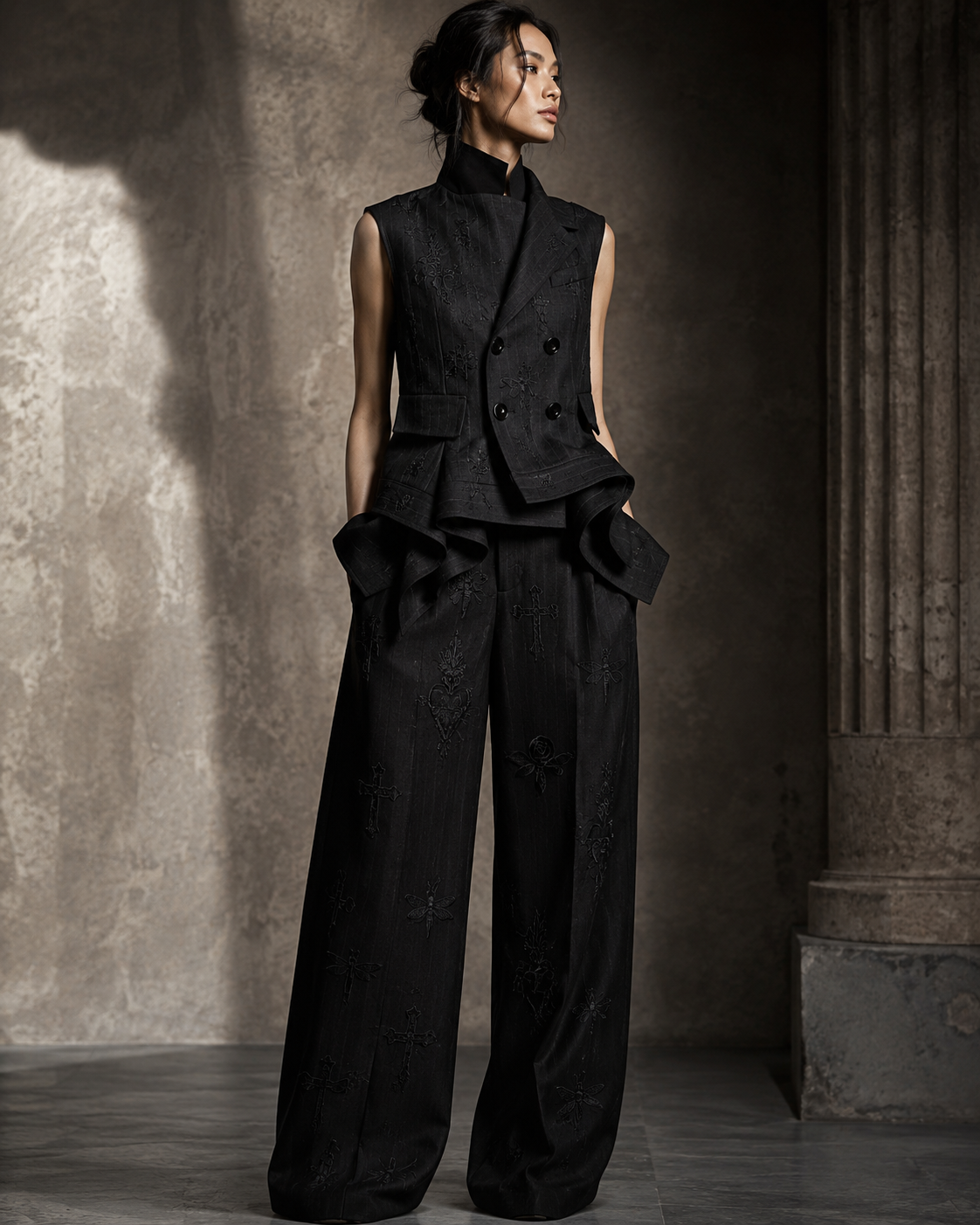 PLIS D’OMBRE Draped Waistcoat & Trouser Set, front view showing the embroidered double-breasted waistcoat, draped hip folds and wide-leg trousers.