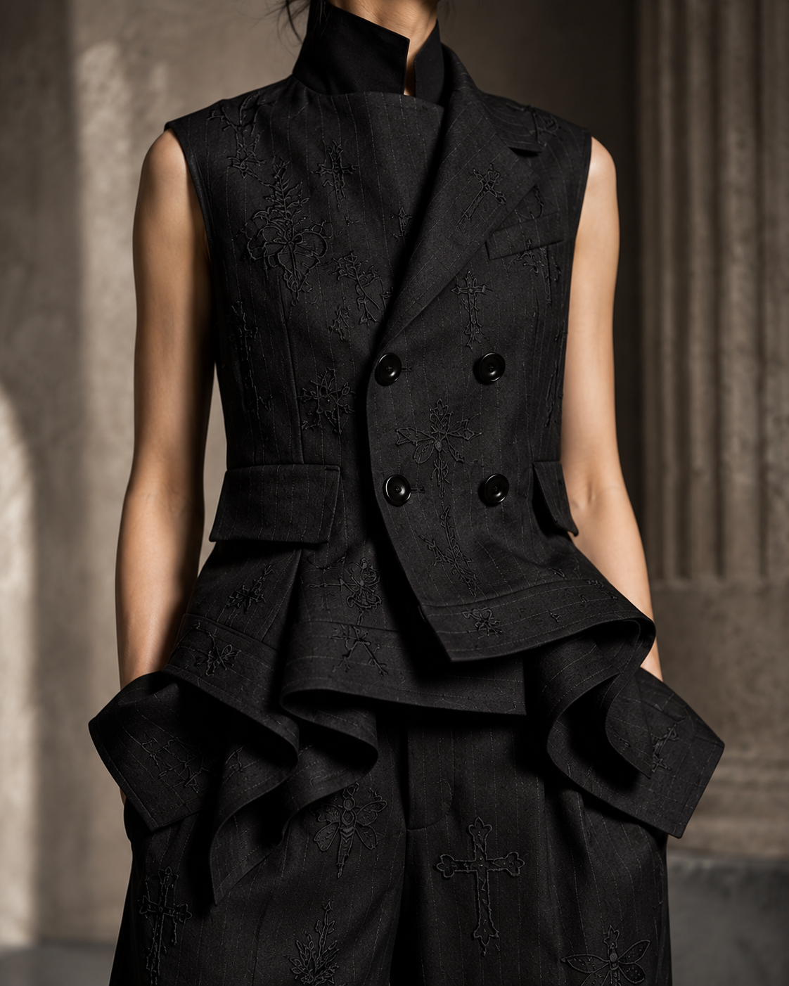 PLIS D’OMBRE Draped Waistcoat & Trouser Set, detail of the high collar, asymmetric lapel, double-breasted buttons and tonal embroidery.